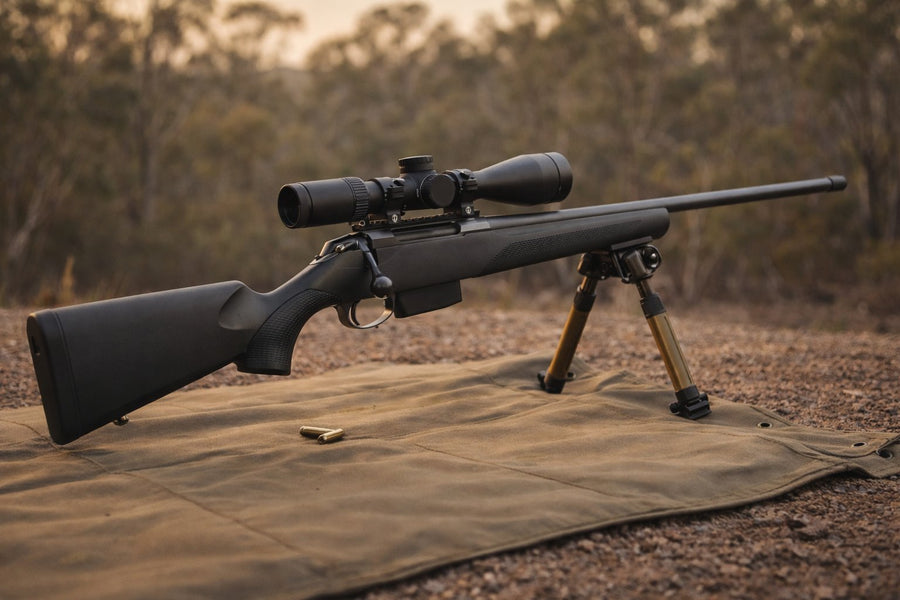 Precision Tikka T3x bolt-action rifle on a bipod at an Australian outdoor range at golden hour