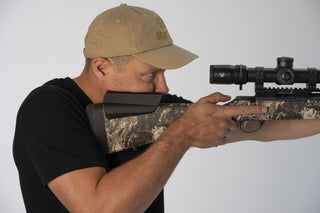 Shooter cheeked in behind a scoped Tikka T3x with the Nokka Drop Comb Cheek Riser fitted — correct cheek weld in use