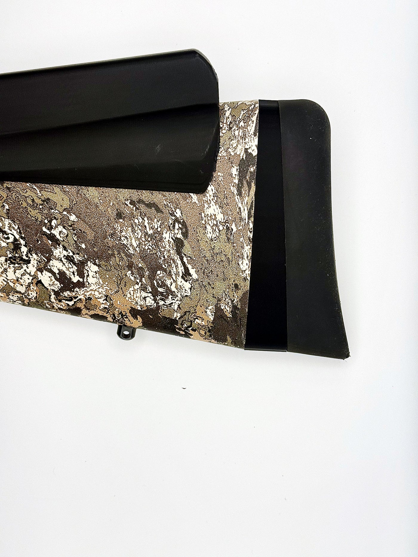 Nokka Flat-Recoil LOP spacer installed on a Tikka T3x — raked wedge between the stock and the recoil pad